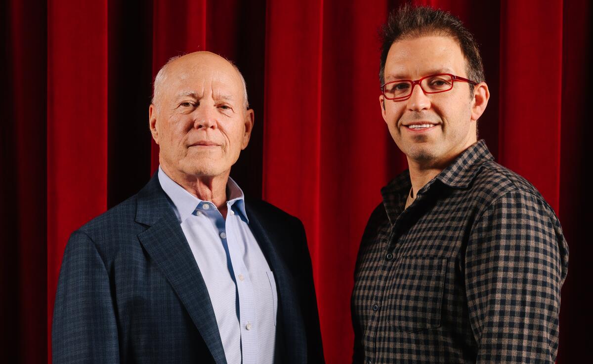 Magician Helder Guimar?es, right,  and director Frank Marshall