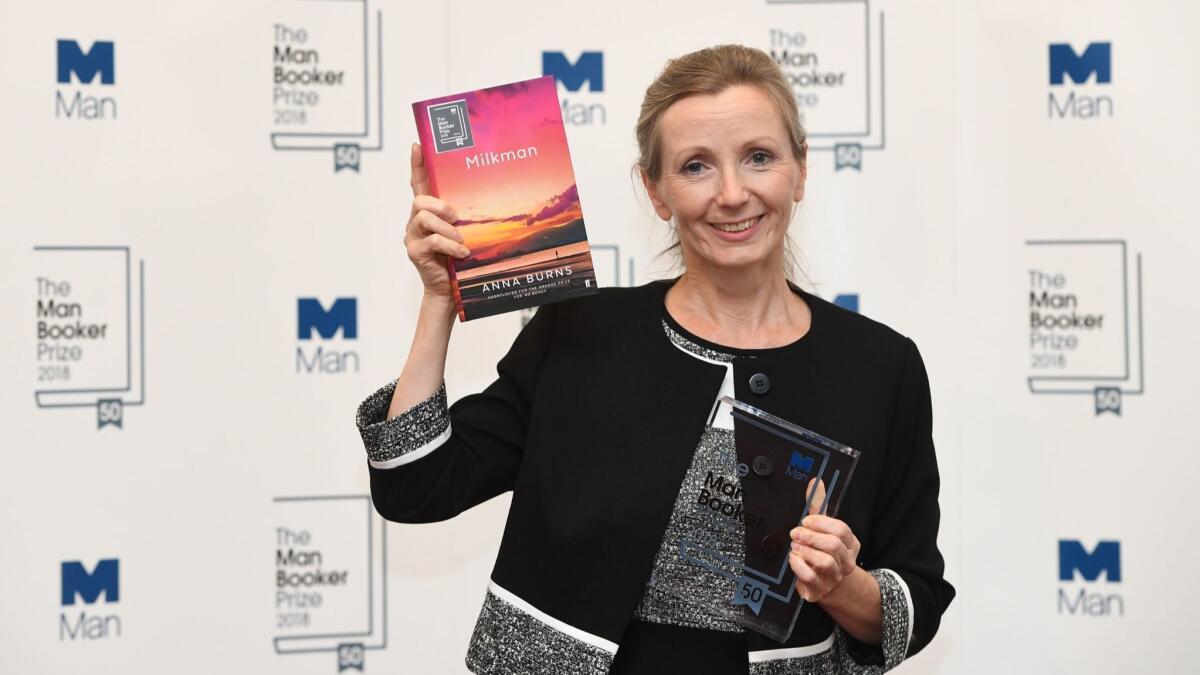 Anna Burns with her book 'Milkman' and her Man Booker Prize.