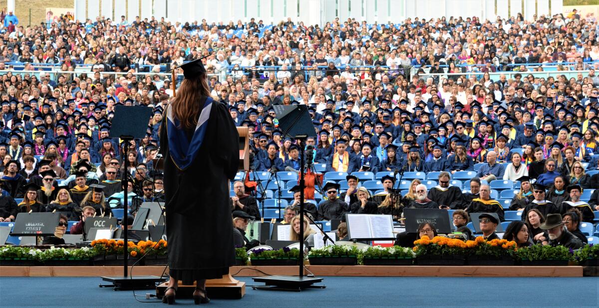 OCC Prof. Kelli Elliot, an Orange County Teacher of the Year, speaks during the school's 75th commencement ceremony.