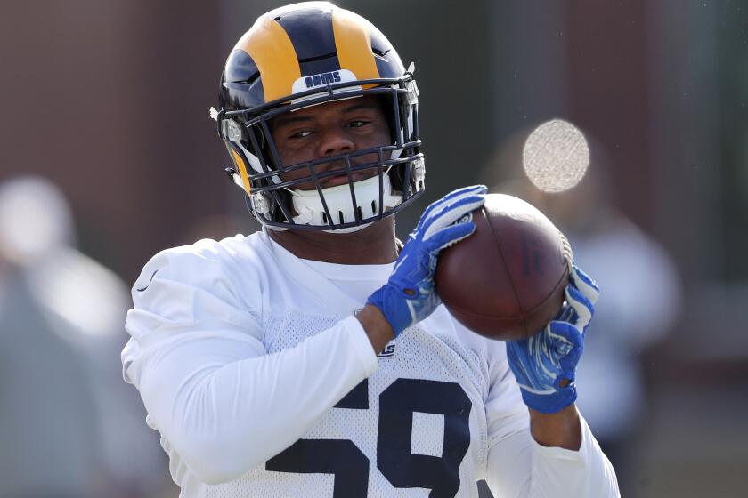 Los Angeles Rams linebacker Micah Kiser (59) catches a ball during practice for the NFL Super Bowl 53 football game against the New England Patriots, Friday, Feb. 1, 2019, in Flowery Branch, Ga. (AP Photo/John Bazemore)