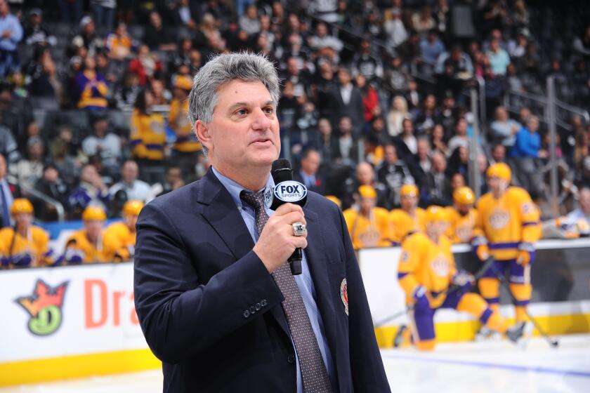 LOS ANGELES, CA - NOVEMBER 10: Nick Nickson speaks prior to the game between the Los Angeles Kings and the Arizona Coyotes after his induction into the Hockey Hall of Fame for his 34 years as broadcaster with the LA Kings on November 10, 2015 at Staples Center in Los Angeles, California. (Photo by Juan Ocampo/NHLI via Getty Images)