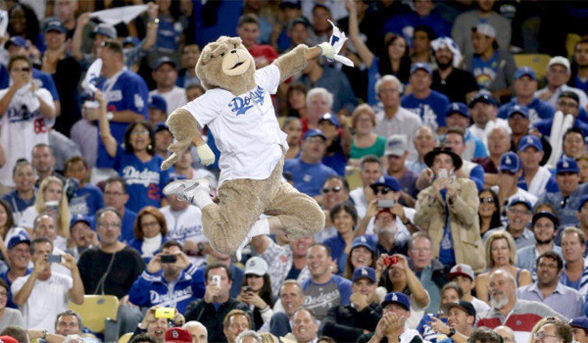 A man dressed in a bear costume jumped on the visiting dugout at Dodger Stadium during Game 3 of the National League Championship Series, earning him a six-month ban from the ballpark.