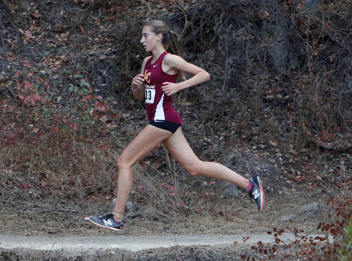 La Canada's Sarah Auther runs a trail for the final mile to the finish in a Rio Hondo League cross-country race at Crescenta Valley Regional Park on Tuesday, October 15, 2019.