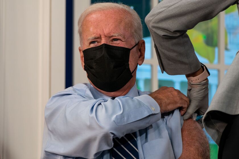 WASHINGTON, DC - SEPTEMBER 27: President Joe Biden receives a booster vaccination shot for CoVID19 in the South Court Auditorium of the Eisenhower Executive Office Building on the White House Complex on Monday, Sept. 27, 2021 in Washington, DC. (Kent Nishimura / Los Angeles Times)