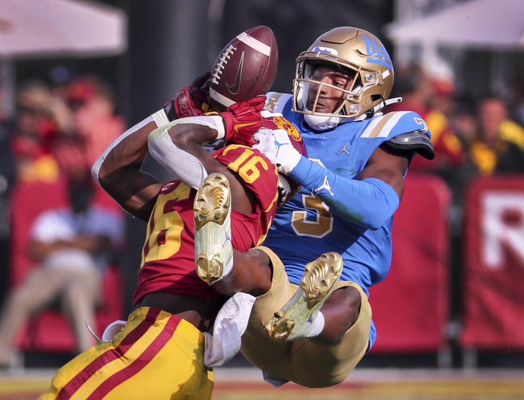UCLA cornerback Cameron Johnson bats the pass away.