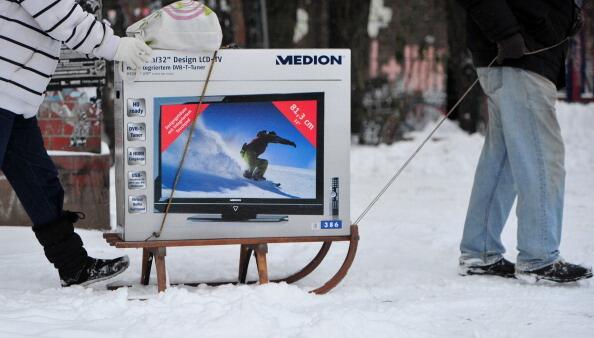 TV being pulled in the snow