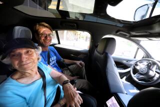Julie Finger, 89, left, and Bill Meyerchak. , 47, check out the passing scenery.