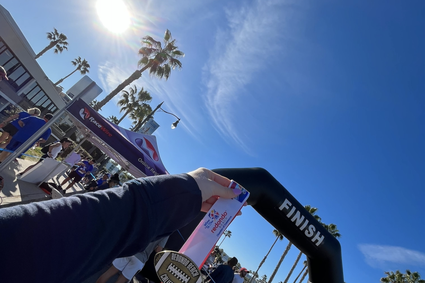 A Super Bowl 10k/5k finisher medal at the Redondo Beach Super Bowl Sunday race