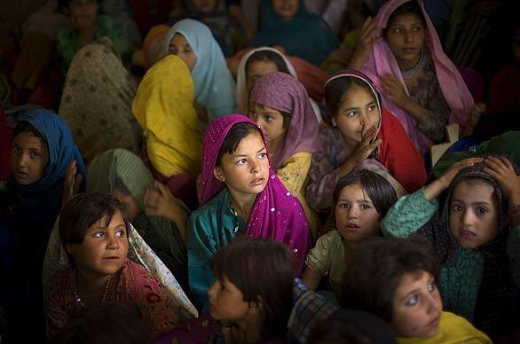 Pakistani girls from the Bajur tribal region are seen in a school supported by UNICEF at the Katcha Garhi refugee camp in Peshawar, Pakistan. Nearly 200,000 people have fled fighting in the volatile border area to camps in Afghanistan and Pakistan.