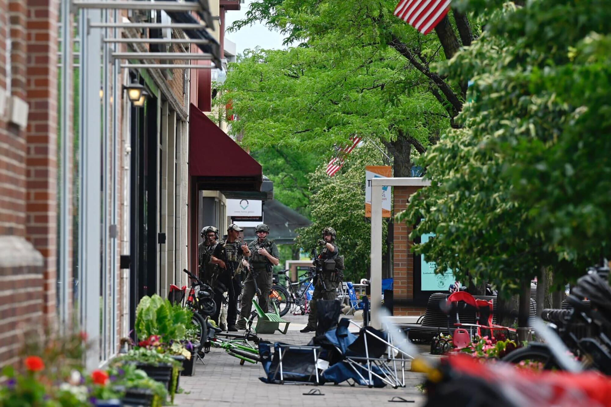 Police search a street.