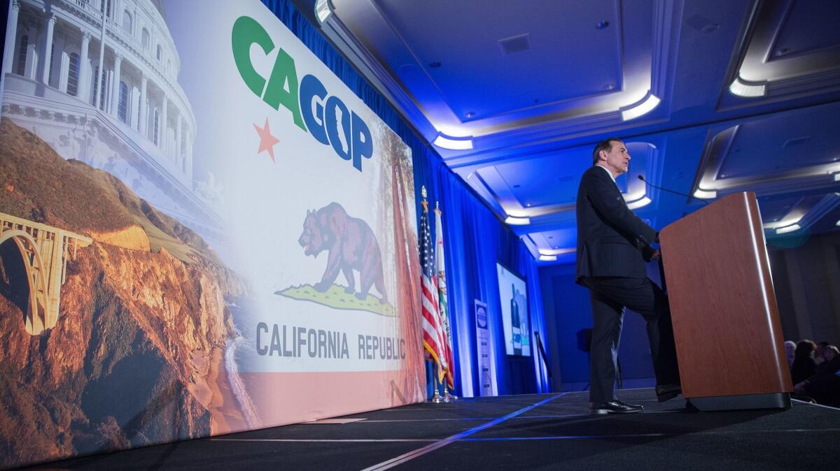 Congressman Darryll Issa takes the stage Saturday, February 25, 2017 during the California Republican Party convention in Sacramento.