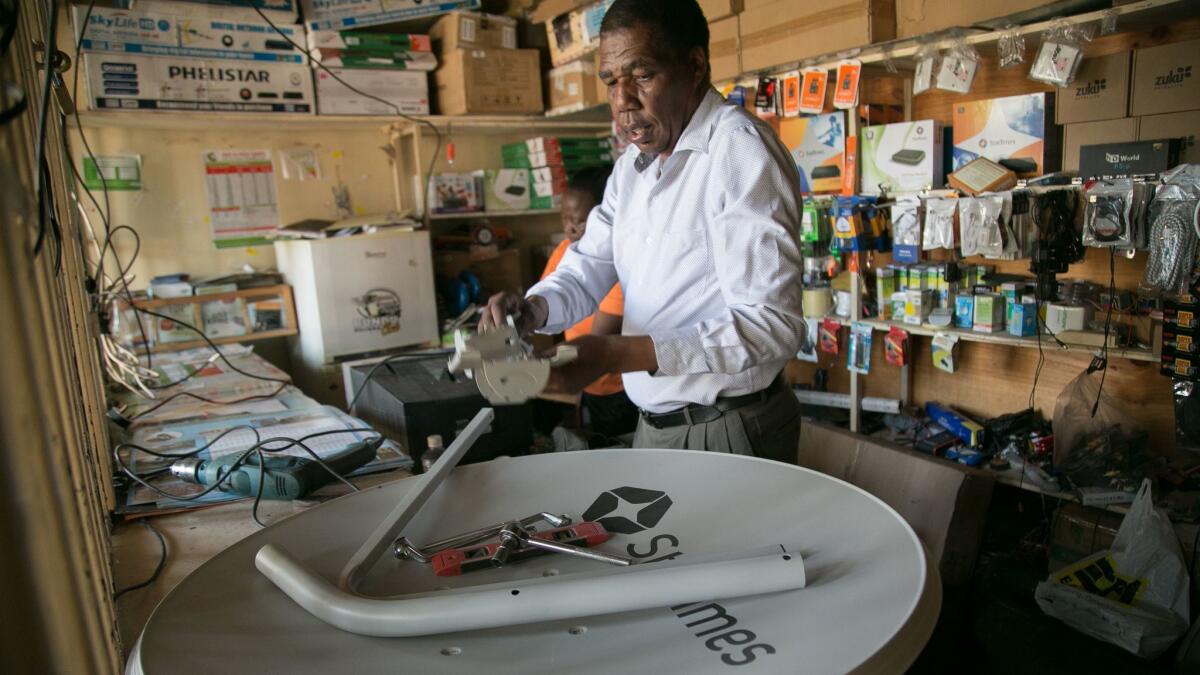David Mugita is StarTimes' sole salesman in Kajiado, Kenya. StarTimes, a privately owned, Beijing-based media and telecommunications firm, has been sweeping across Africa since 2002. (Immanuel Muasya / For The Times)