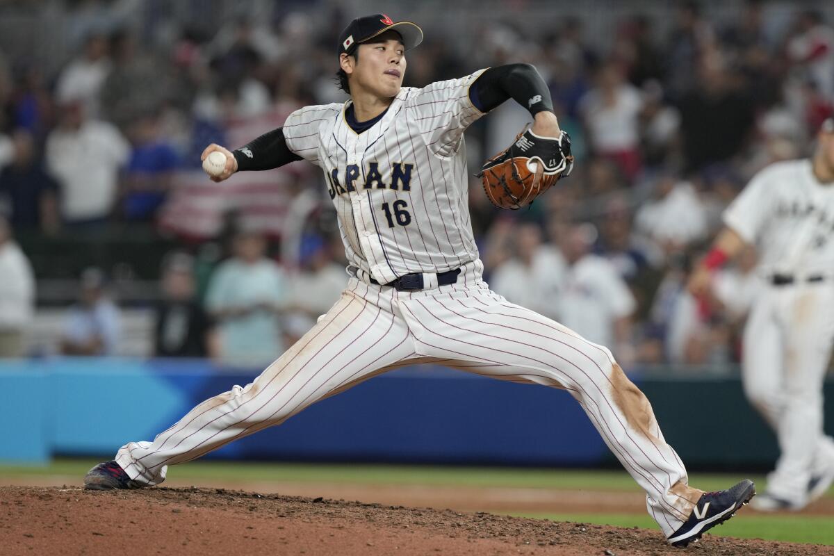 Japan's Shohei Ohtani pitches against the United States in the World Baseball Classic final.