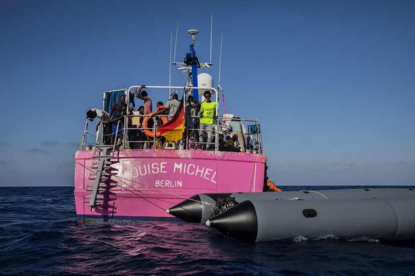 Migrants aboard a rescue vessel sponsored by the artist Banksy in the Mediterranean Sea.