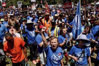 LOS ANGELES CA JUNE 21, 2023 - With the Writers Guild of America strike now in its eighth week, thousands of union members and supporters marched from Pan Pacific Park toward a planned multi-union rally near the La Brea Tar Pits Wednesday, June 21, 2023. (Irfan Khan / Los Angeles Times)