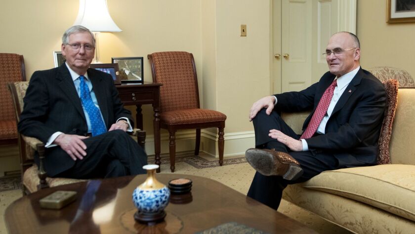 Secretary of Labor nominee Andrew Puzder, right, meets with Senate Majority Leader Mitch McConnell in the Capitol on Jan. 5.