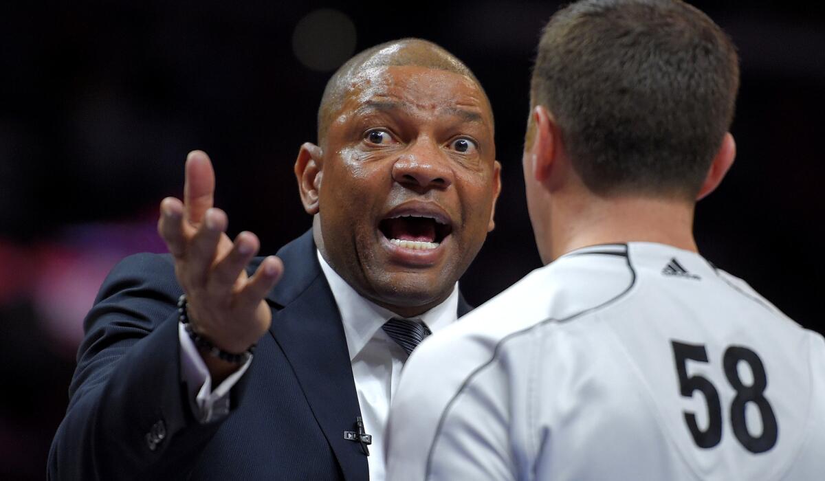 Clippers Coach Doc Rivers talks to official Josh Tiven during the second half of Game 5 on Tuesday night at Staples Center.