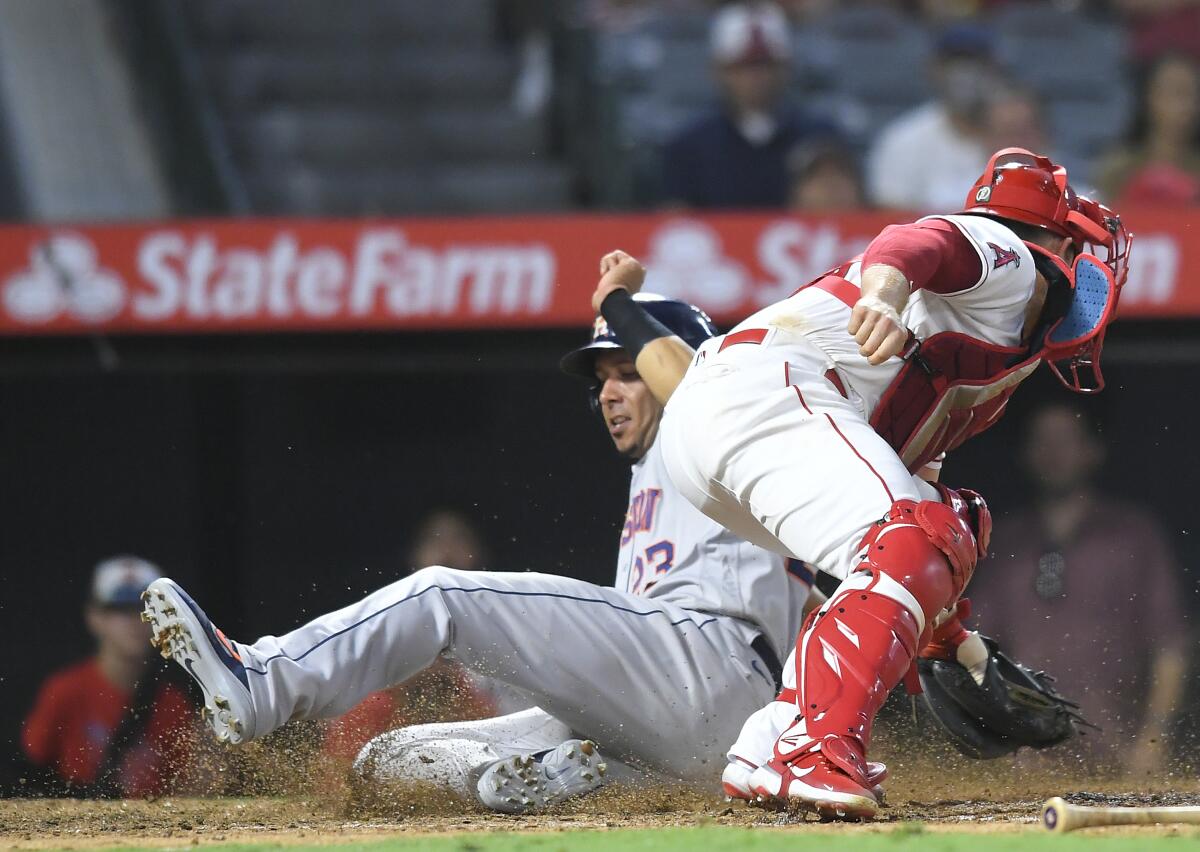The Astros scored eight straight runs to win Saturday over the Angels. (AP Photo/John McCoy)