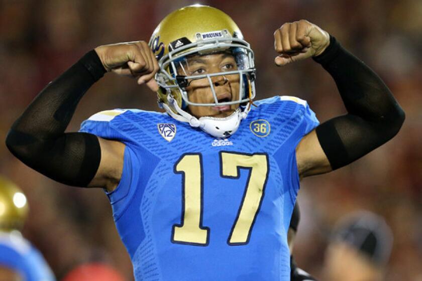 UCLA quarterback Brett Hundley celebrates a Bruins touchdown against USC last month. Will Hundley find success against the Virginia Tech secondary in Tuesday's Sun Bowl?