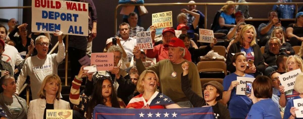 Demonstrators protest against Senate Bill 54, a California “sanctuary state” law, during a Huntington Beach City Council meeting in April 2018.