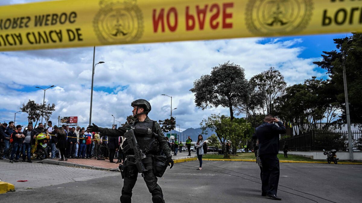 Security forces stand guard at the site of the police academy bombing in Bogota, Colombia, on Jan. 17.