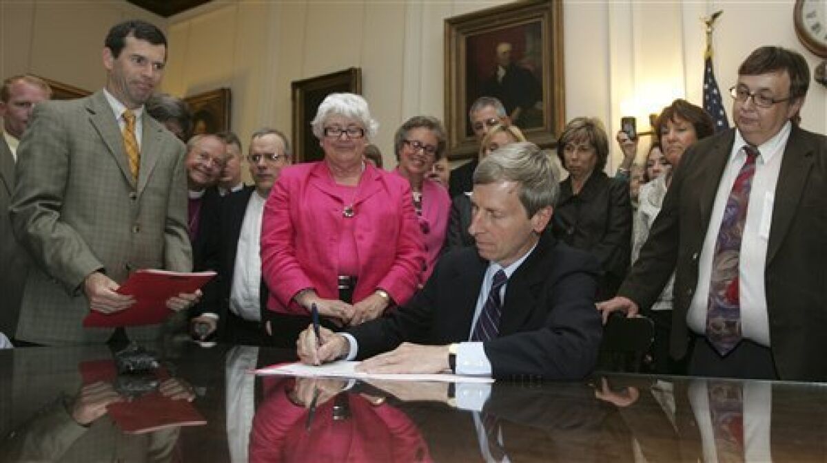 Supporters watch as Gov. John Lynch, D-N.H., signs gay marriage into law at the State house in Concord, N.H., Wednesday, June 3, 2009.(AP Photo/Jim Cole)