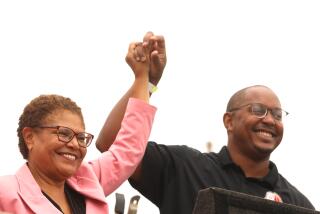 LOS ANGELES, CA - SEPTEMBER 17, 2022 - - Los Angeles mayoral candidate Rep. Karen Bass and Long Beach Vice Mayor Rex Richardson, who is running for mayor of Long Beach, raise their hands together at a rally and BBQ at the headquarters for The Los Angeles County Federation of Labor, AFL-CIO to help mobilize for this election season in Los Angeles on Saturday, September 17, 2022. (Genaro Molina / Los Angeles Times)
