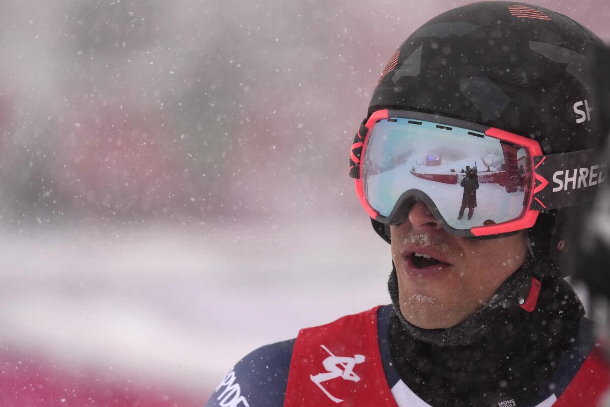 U.S. skier Tommy Ford looks up after finishing the first run of the men’s giant slalom Sunday at the 2022 Winter Olympics.
