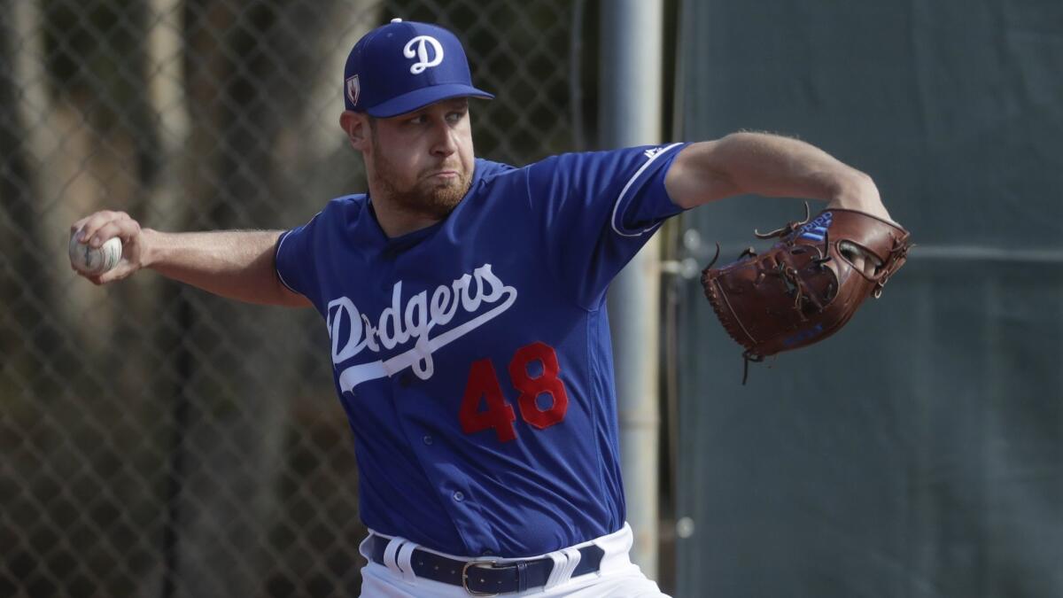 Dodgers pitcher Brock Stewart throws during a spring training workout on Feb. 16.