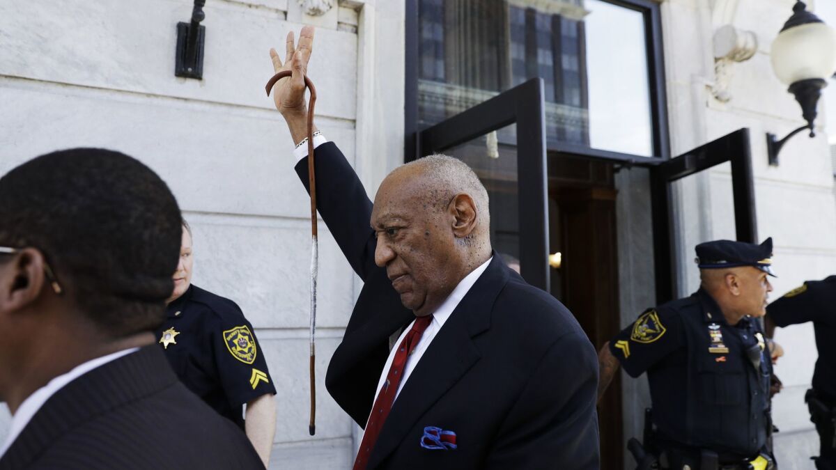 Bill Cosby gestures as he leaves the courthouse in Norristown, Pa., after being convicted of drugging and molesting a woman,