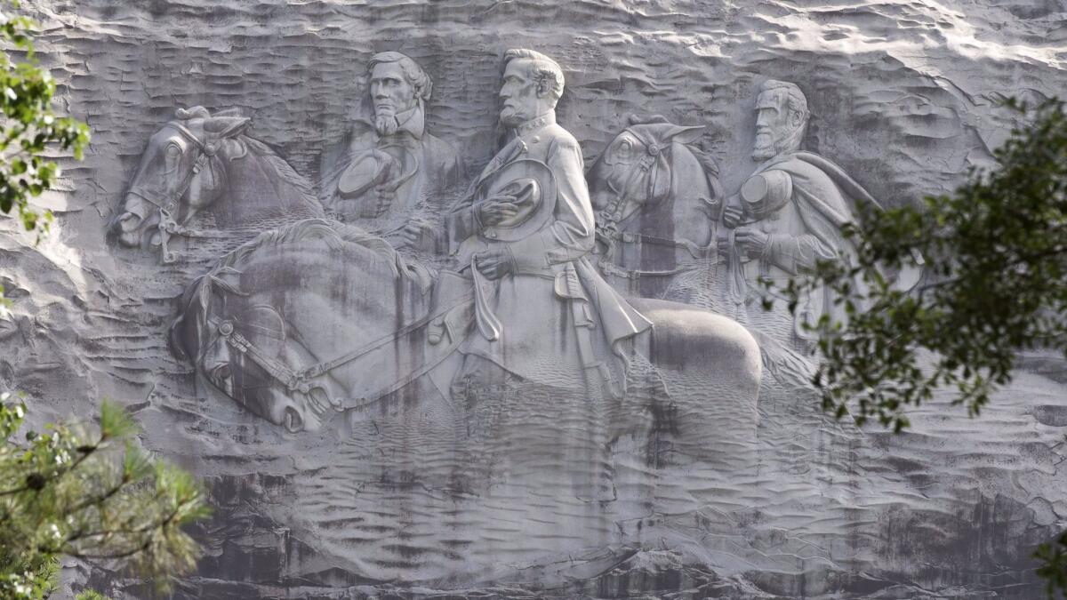 A June 23, 2015, photo shows a carving depicting Confederates Stonewall Jackson, Robert E. Lee and Jefferson Davis in Stone Mountain, Ga. (John Bazemore / Associated Press)