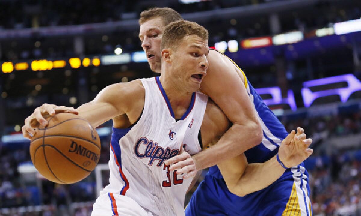 Clippers power forward Blake Griffin, front, drives past Golden State Warriors forward David Lee during a March 12 game. The Warriors are a team the Clippers could potentially face in the first round of the playoffs.