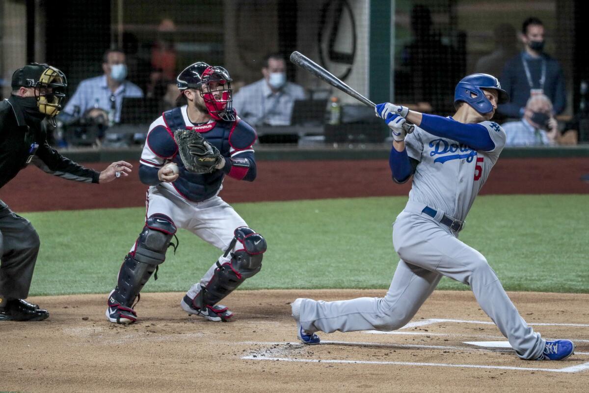 Dodgers shortstop Corey Seager strikes out during the first inning of Game 5 of the NLCS against the Atlanta Braves.