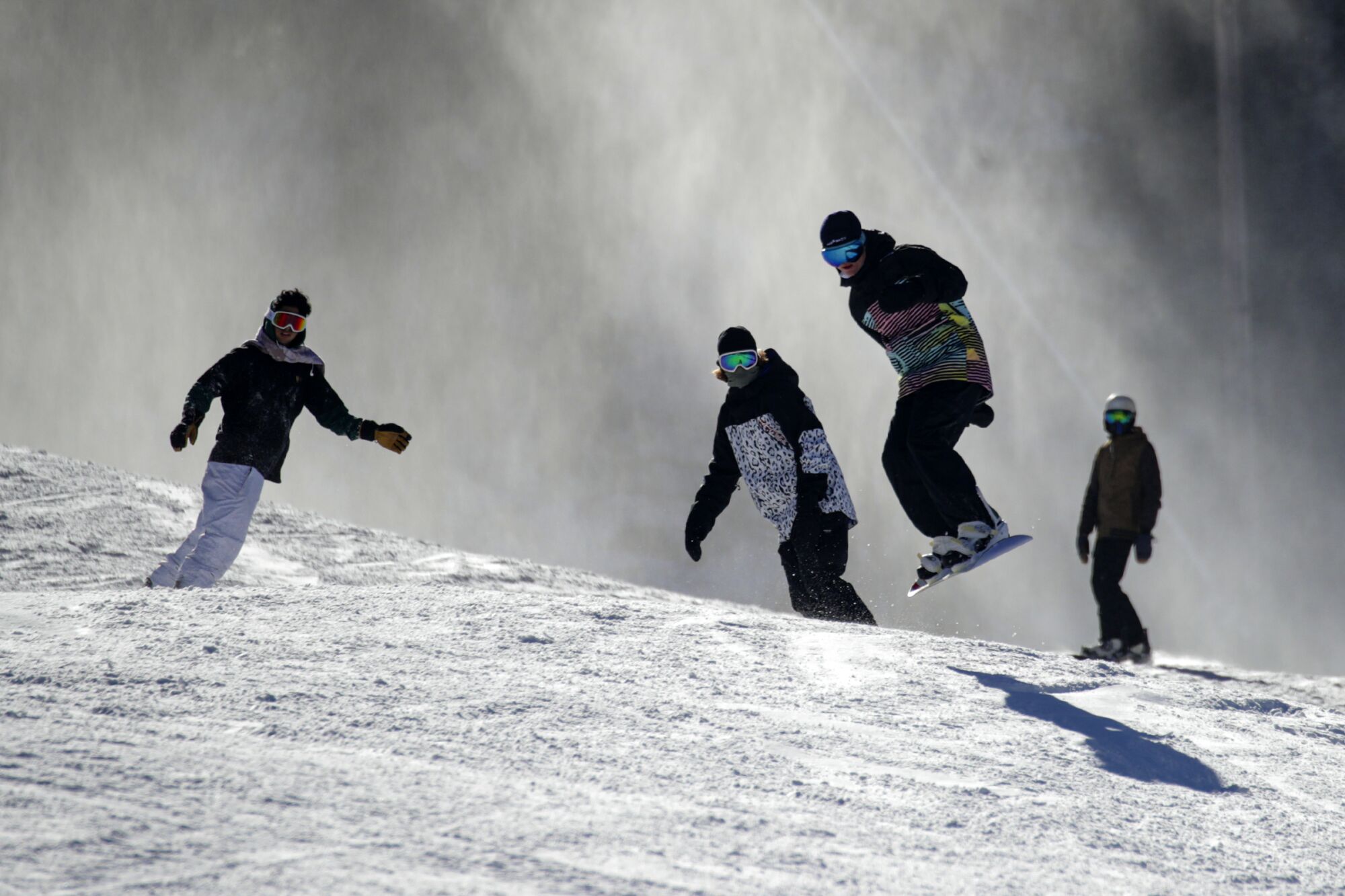 Snow boarders enjoy fresh powder at Mountain High in Wrightwood.