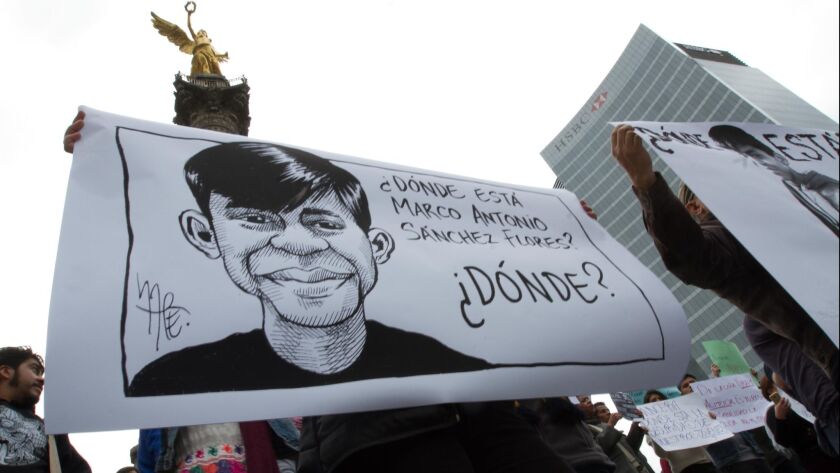 Demonstrators gathered in Mexico City on Jan. 28 to protest the disappearance of Marco Antonio Sanchez, a 17-year-old student who went missing after being arrested by police.