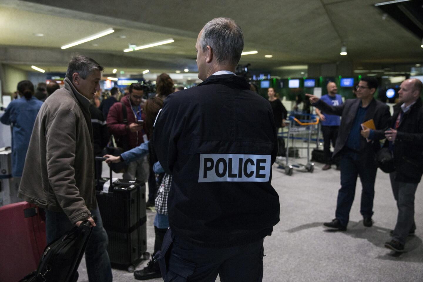 A French member of the border police stands guard at Roissy Charles de Gaulle airport.