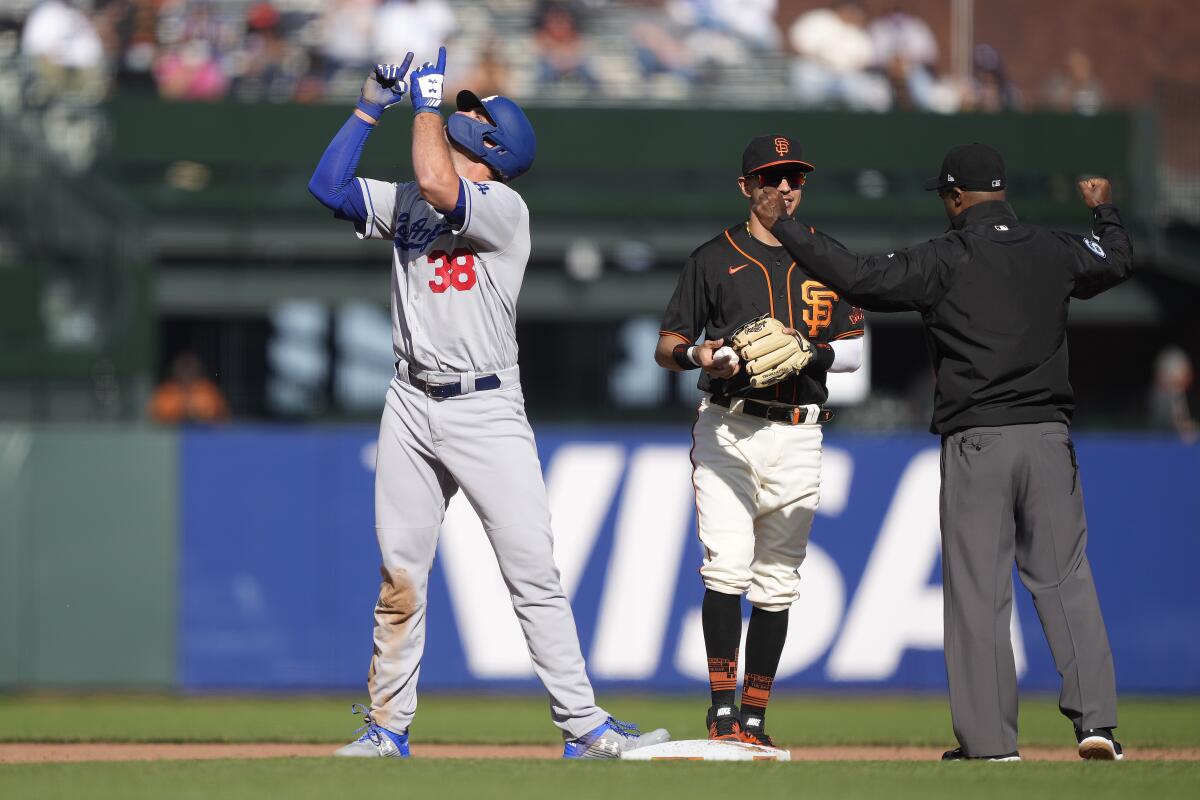 DJ Peters points skyward after hitting a double against the San Francisco Giants during the fifth inning.