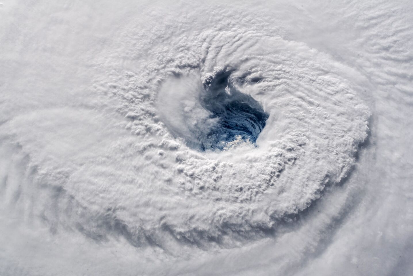 In this Sept. 12, 2018 photo provided by NASA, Hurricane Florence churns over the Atlantic Ocean heading for the U.S. east coast as seen from the International Space Station. Astronaut Alexander Gerst, who shot the photo, tweeted: "Ever stared down the gaping eye of a category 4 hurricane? It's chilling, even from space."