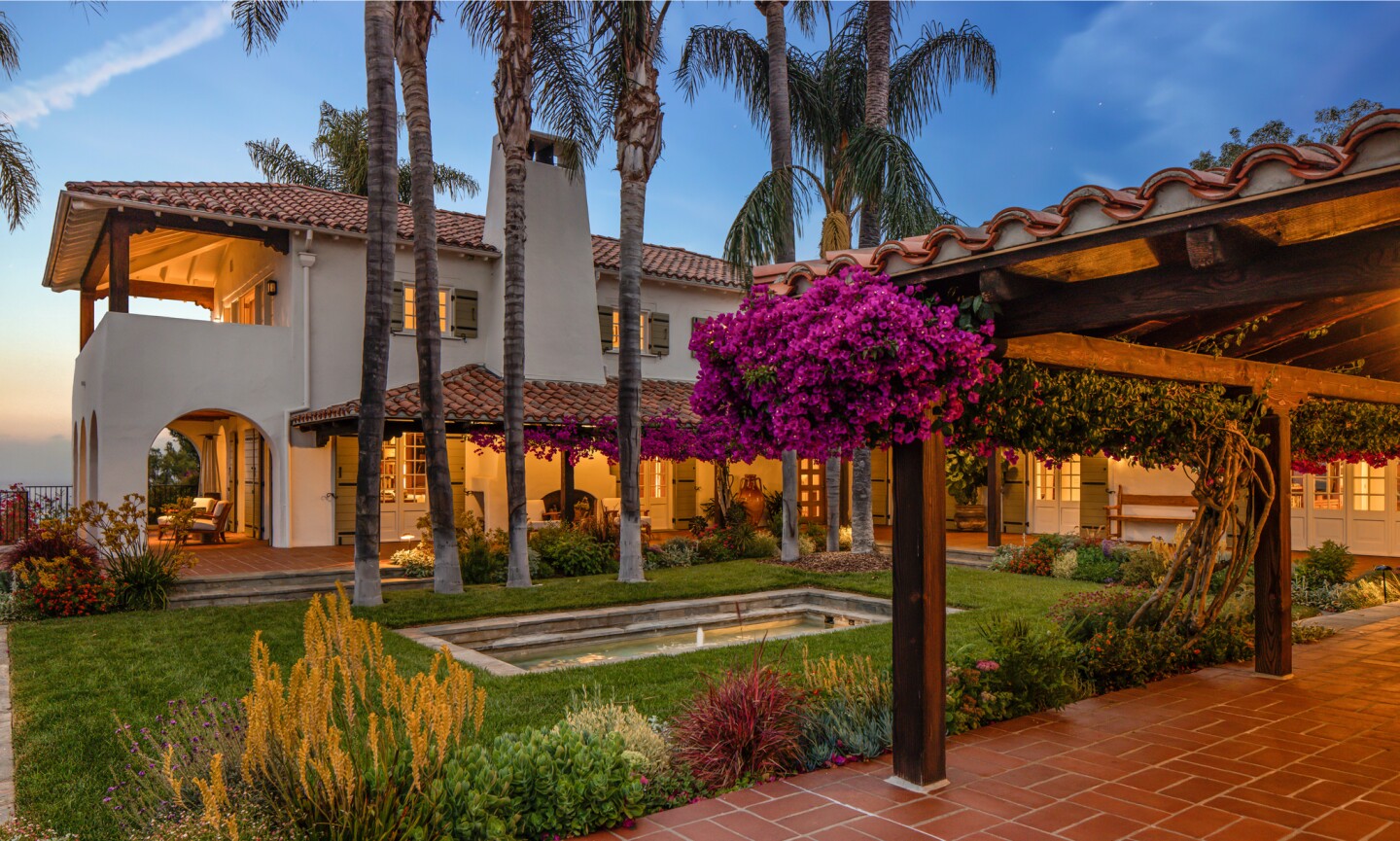 The 3-acre spread includes a 1920s main house, guesthouse, recording studio, movie theater and glass funicular that runs from the pool to the tennis court.