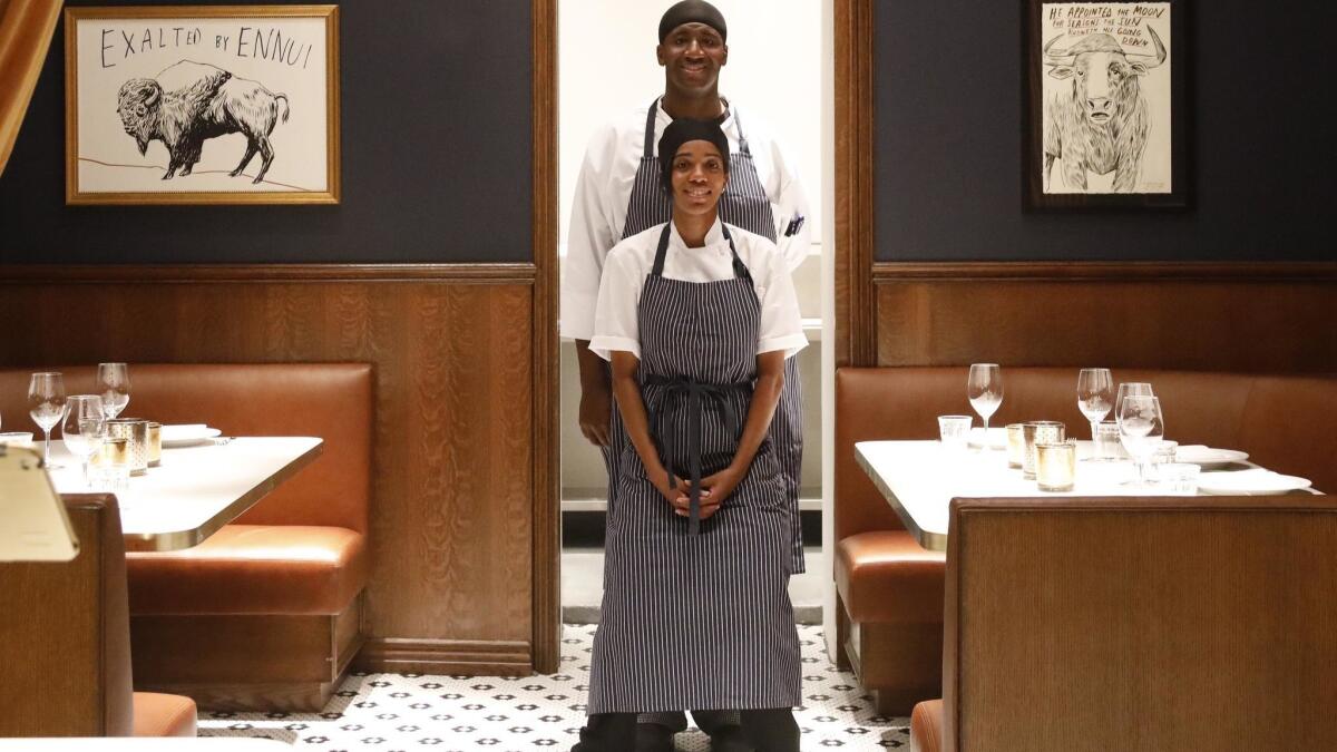 APL cooks Marcus Lewis and Zia Hughes are responsible for the take-away counter at the restaurant.