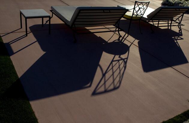 Long shadows by the swimming pool.