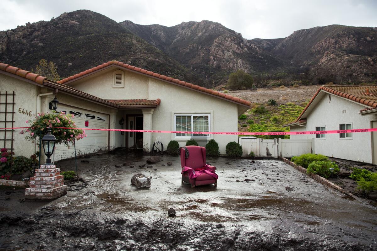 A mud-filled home along San Como Lane is destroyed after it stood in the way of a mudslide that Friday night in Camarillo.