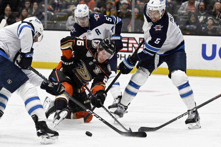 Anaheim Ducks left wing Brock McGinn (26) vies for the puck with Winnipeg Jets left wing.