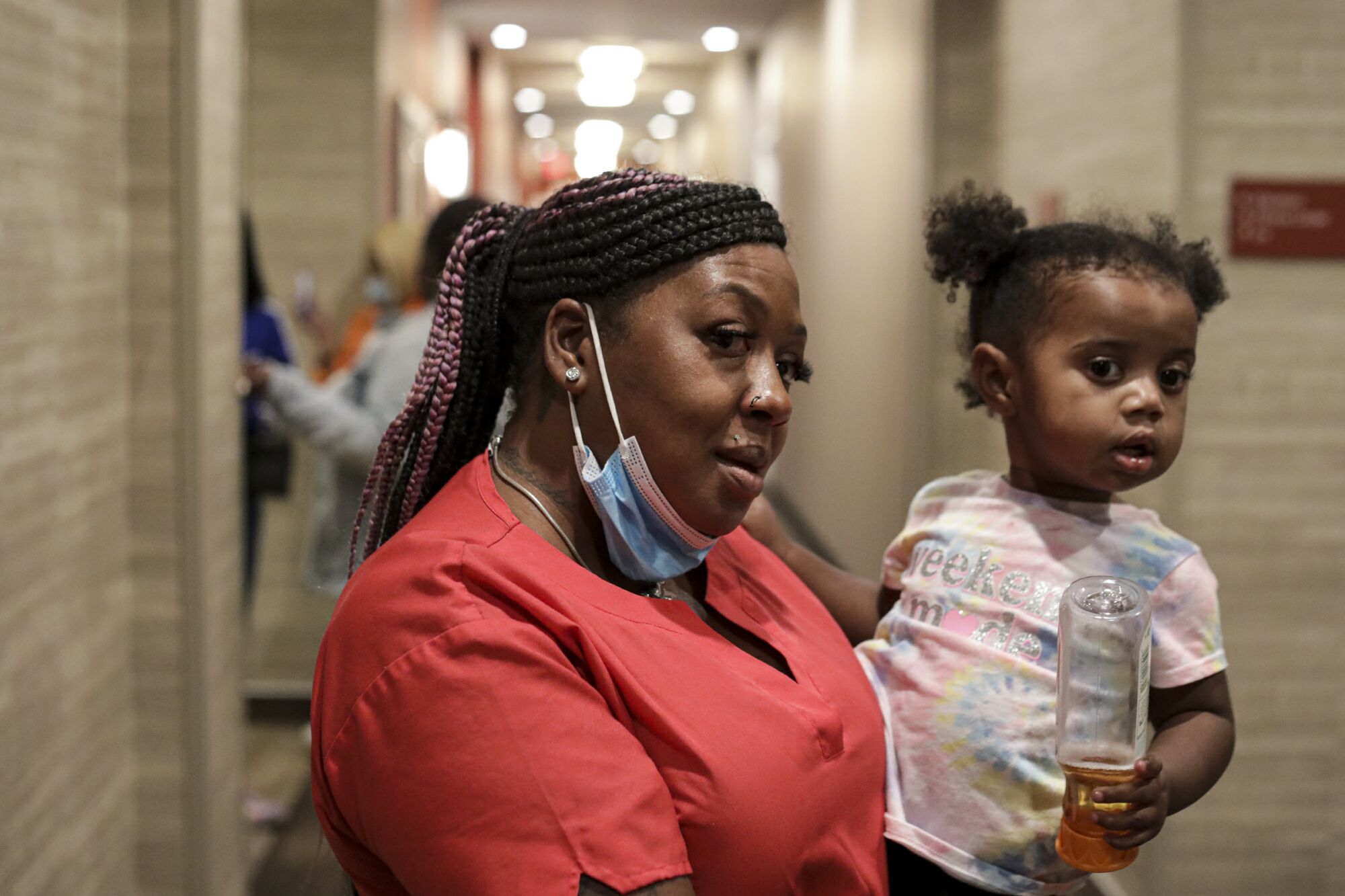Traveling nurse Reshicka Upshaw holds her 22-months-old daughter, Jayianna Shelton. 