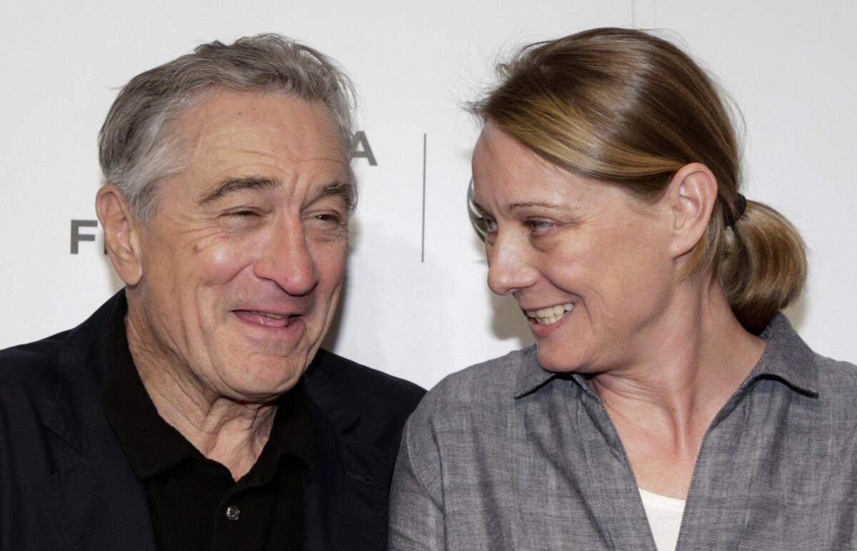 Tribeca Film Festival Co-founder Robert De Niro and director Camilla Nielsson, whose film "Democrats" scored the prize for documentary, share a moment after the Tribeca Film Festival awards ceremony.