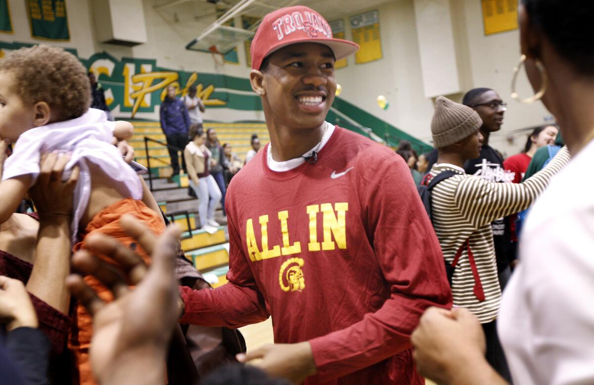 Long Beach Poly five-star cornerback Jack Jones is all smiles in his USC t-shirt on National signing day.
