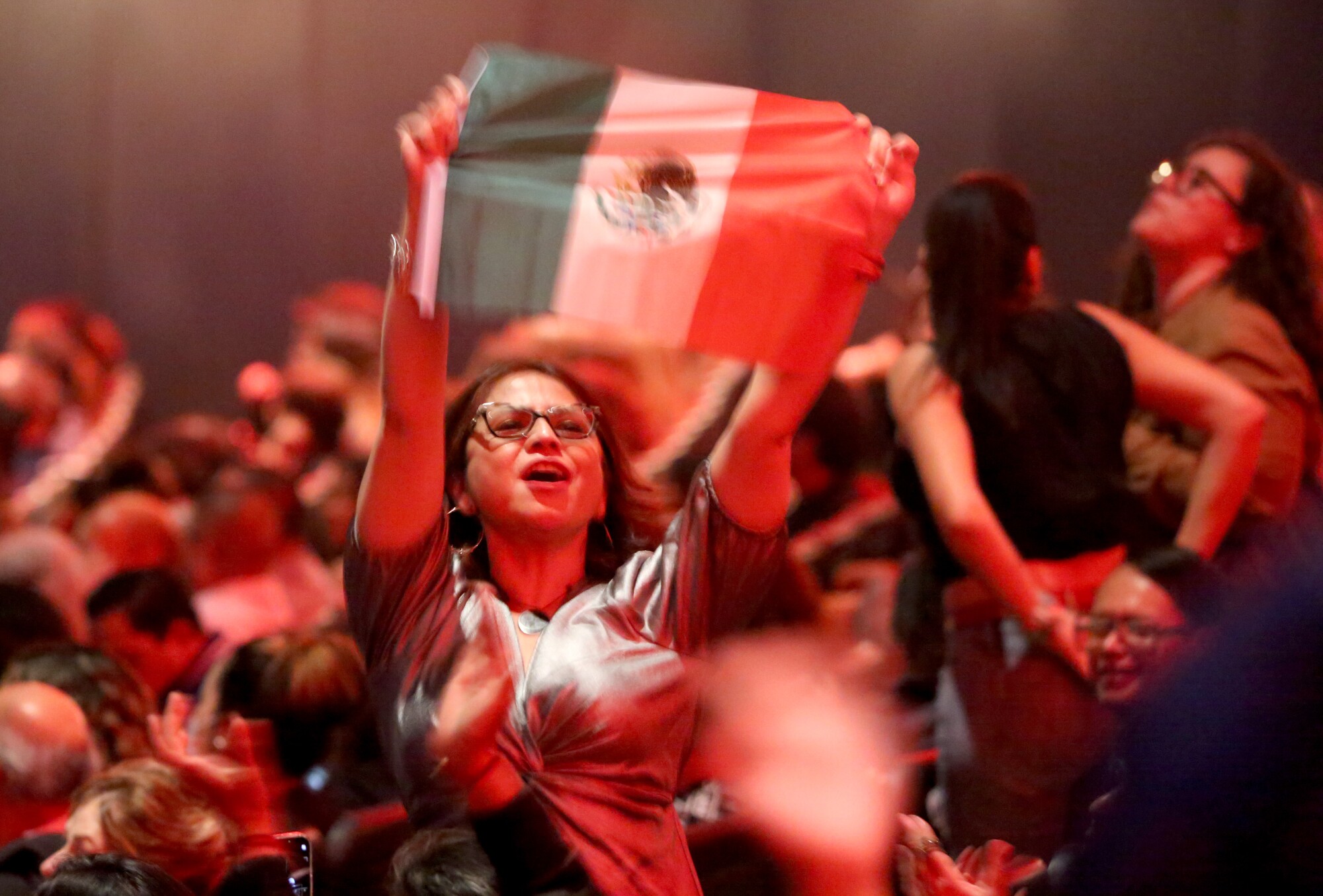 A fan waves a Mexican