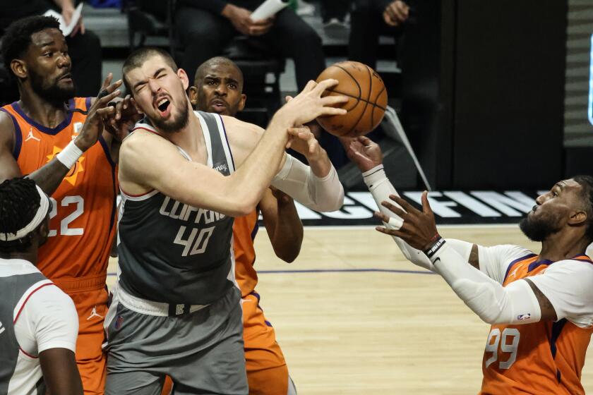 Saturday, June 26, 2021, Los Angeles CA - LA Clippers center Ivica Zubac (40) is fouled by Phoenix Suns forward Jae Crowder (99) late in Game four of the NBA Western Conference Finals at Staples Center. (Robert Gauthier/Los Angeles Times)