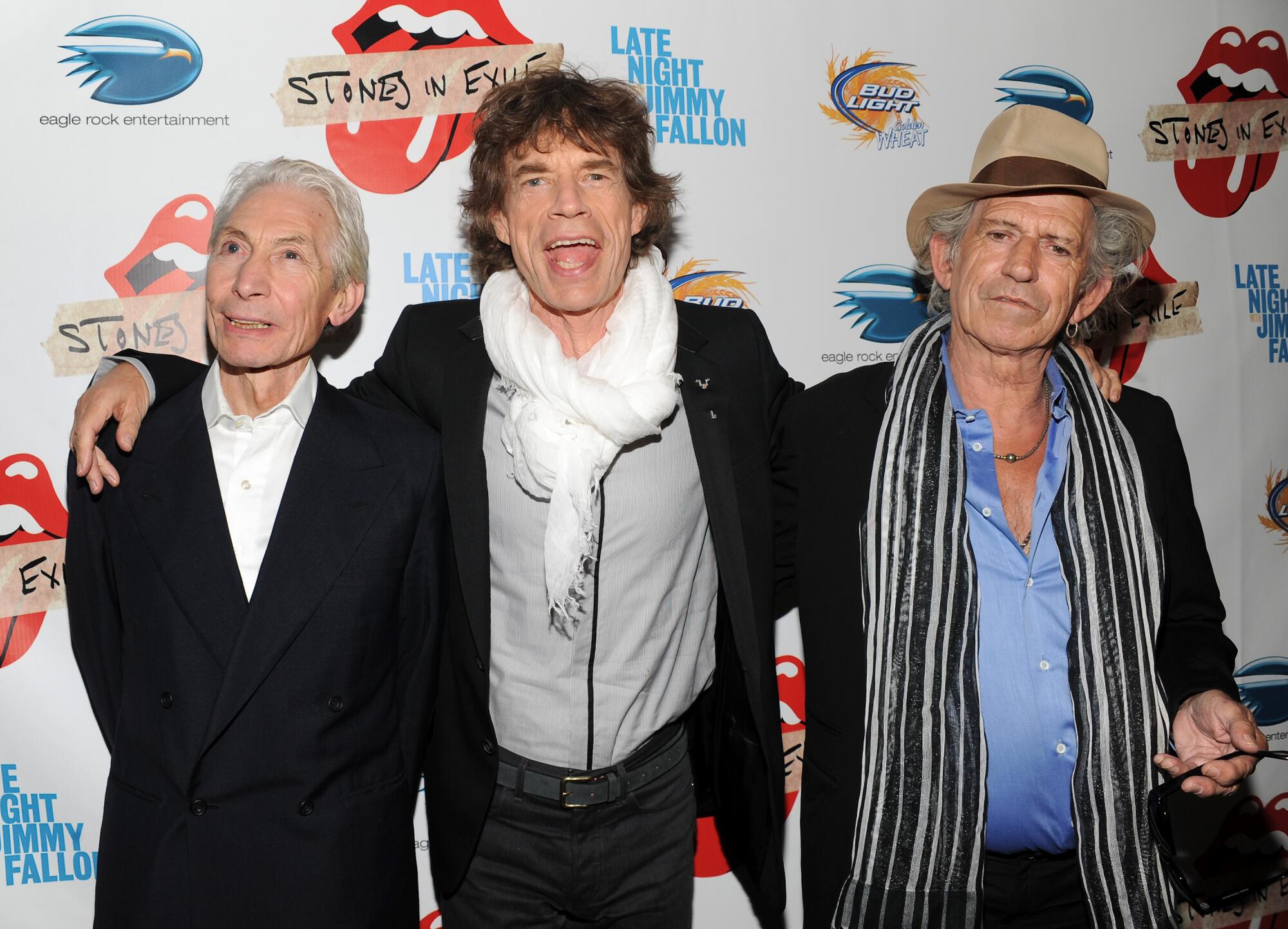 Mick Jagger, center, with his arms around the shoulders of Charlie Watts and Keith Richards.