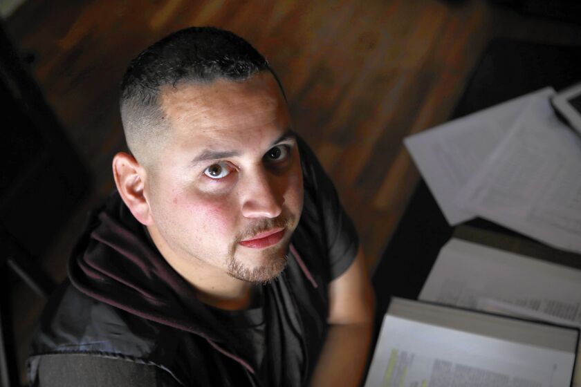 Omar Medina, a former law student at Northwestern California University, at home in Murrieta.
